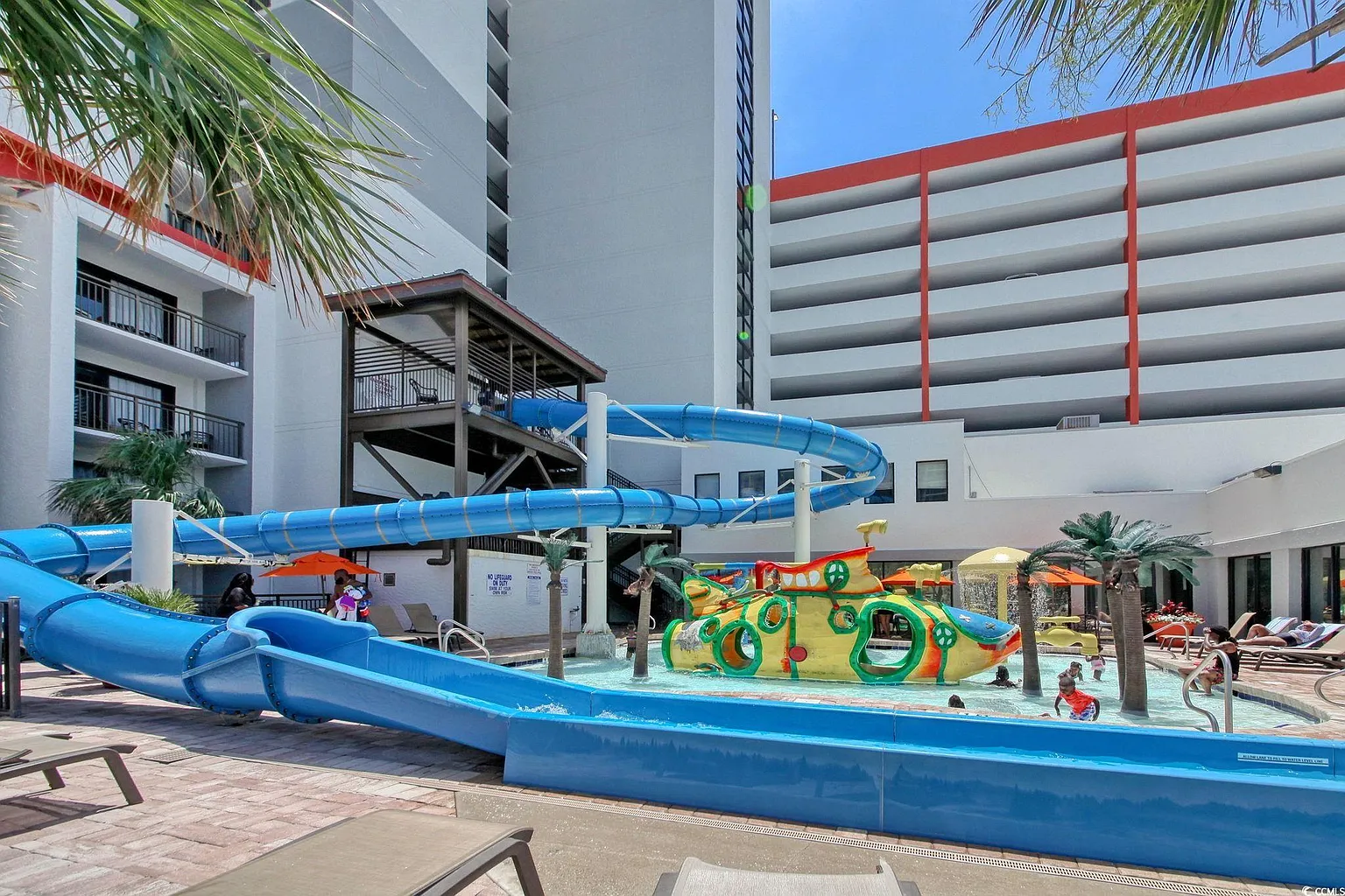 Multi-story water slide with gentle turns at Grande Cayman Resort
