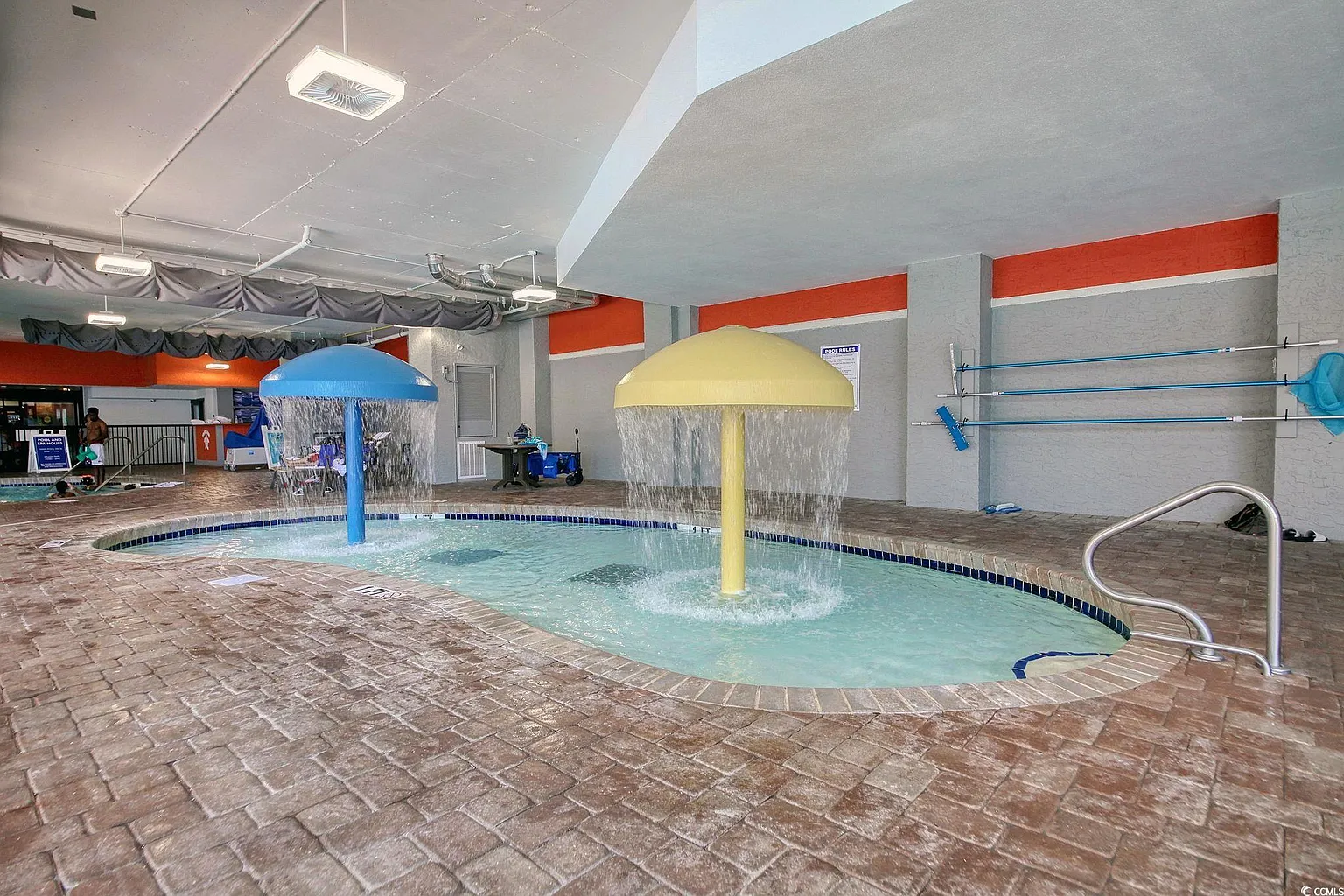Shallow splash pool with fountains for toddlers and young kids